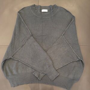 Woman’s dark olive green oversized sweater